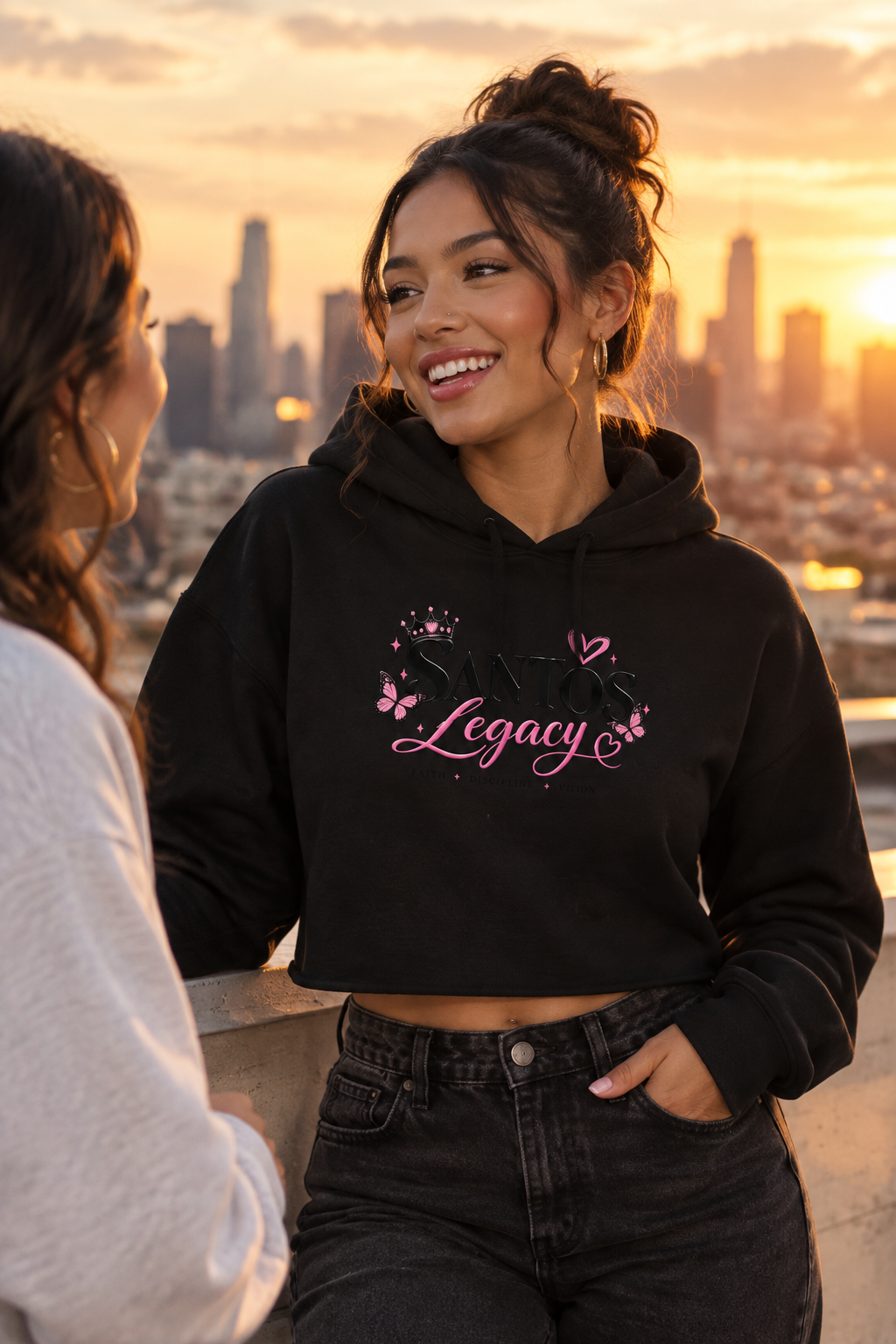 Crop hoodie: two women chatting on a rooftop at golden hour