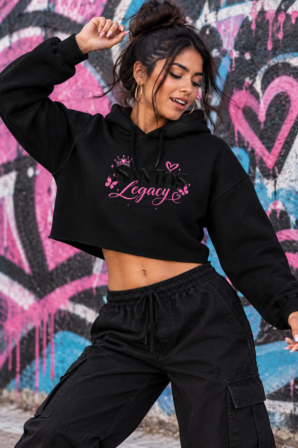 Crop hoodie: woman dancing by a graffiti wall