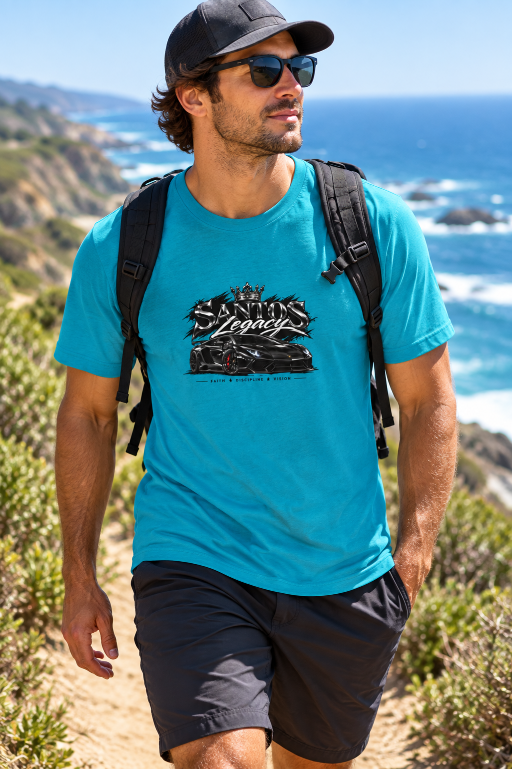 Man wearing the Santos Legacy Signature Unisex t-shirt hiking a coastal trail