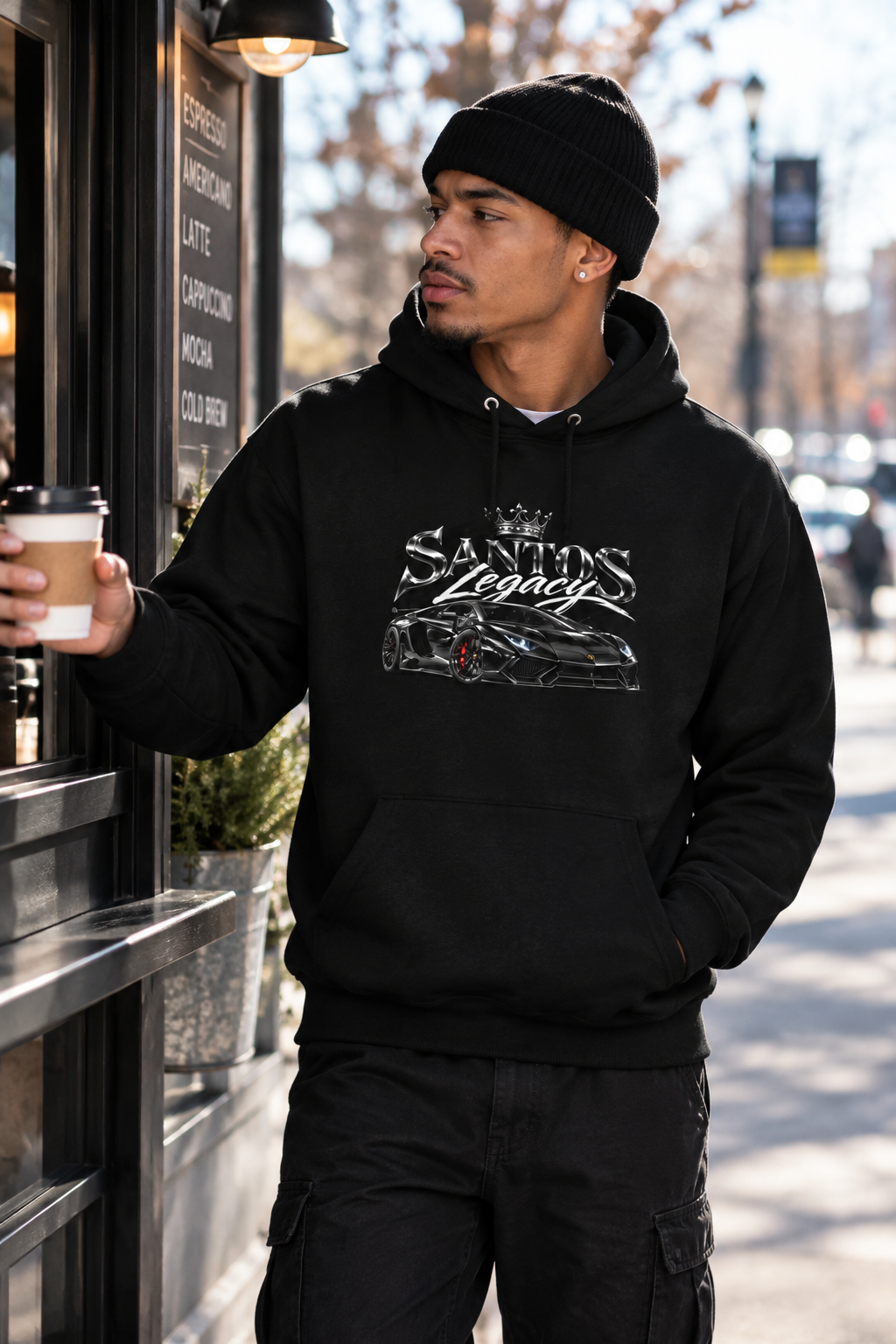 Man wearing the Santos Legacy Signature Premium Hoodie at an outdoor coffee takeout window