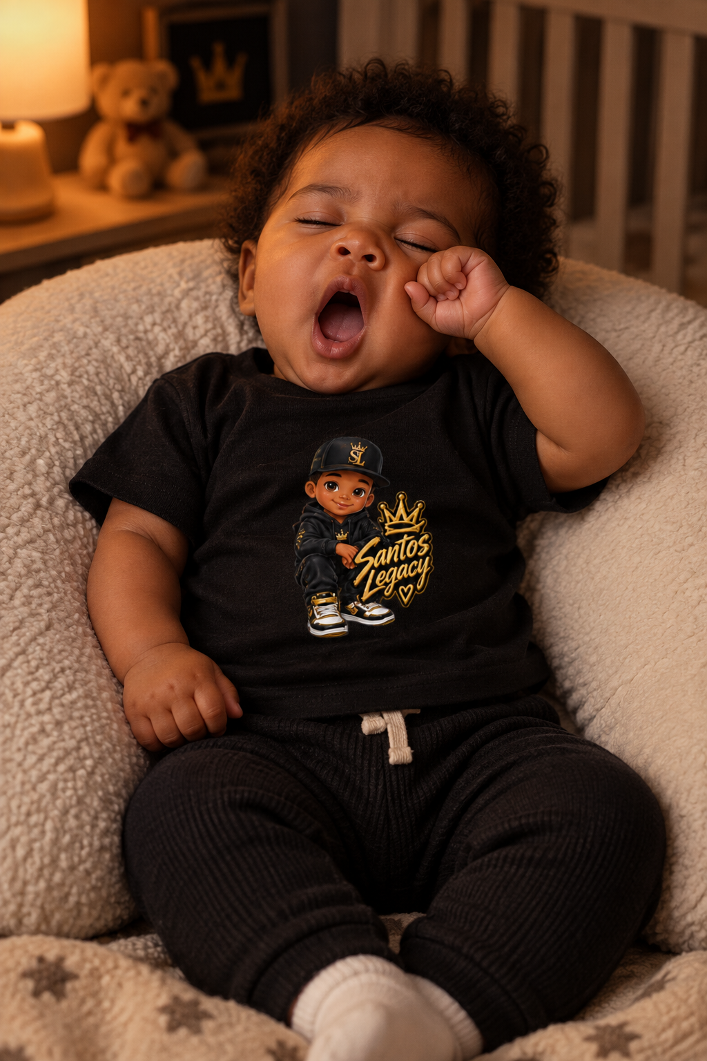 Sleepy baby wearing the Santos Legacy Baby Jersey Short Sleeve Tee yawning in a nursing pillow